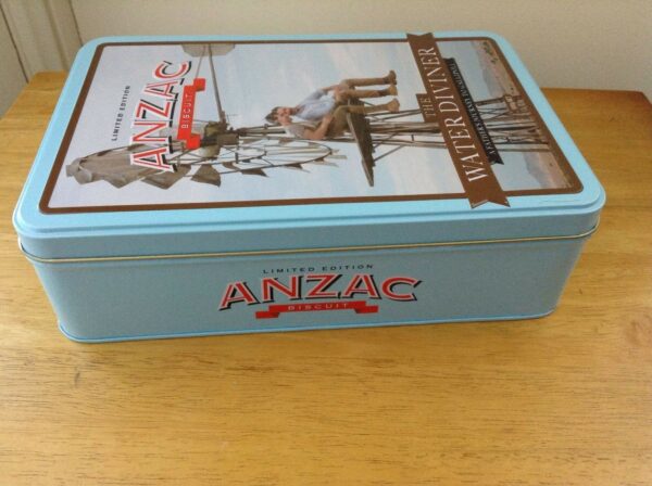 UNIBIC ANZAC Biscuits, 'The Water Diviner', red on sky-blue, 500g. Biscuit Tin