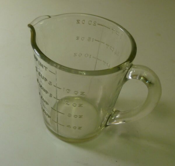 Jug, measuring, 1 pint, in depression clear glass, c.1930's