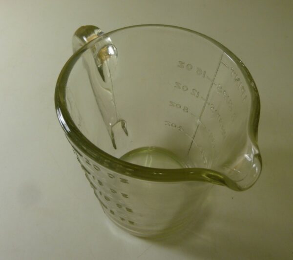 Jug, measuring, 1 pint, in depression clear glass, c.1930's