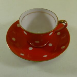 SUPERIOR QUALITY, Coffee Can & Saucer, in white on red polka dot ceramic