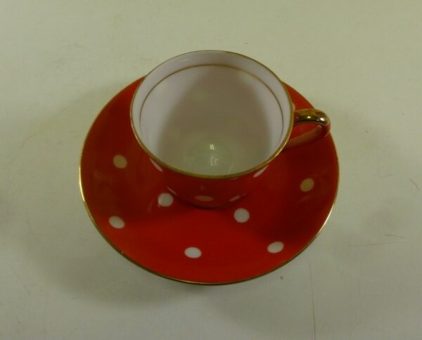 SUPERIOR QUALITY, Coffee Can & Saucer, in white on red polka dot ceramic
